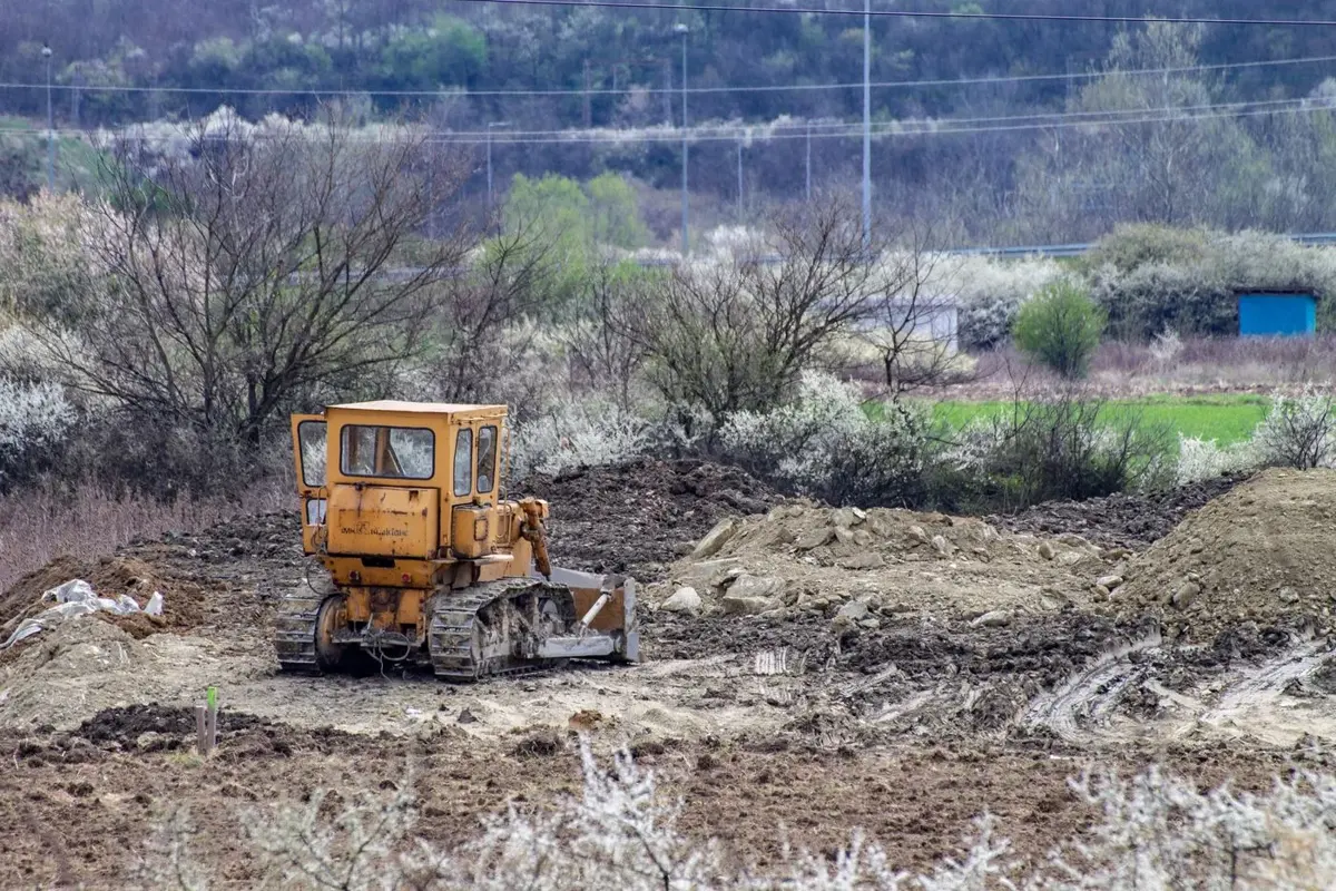 Bulldozer clearing an undeveloped plot